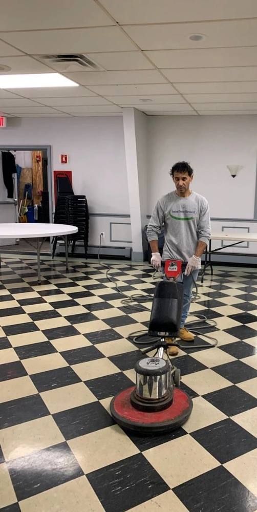 Our crew buffing a tile floor